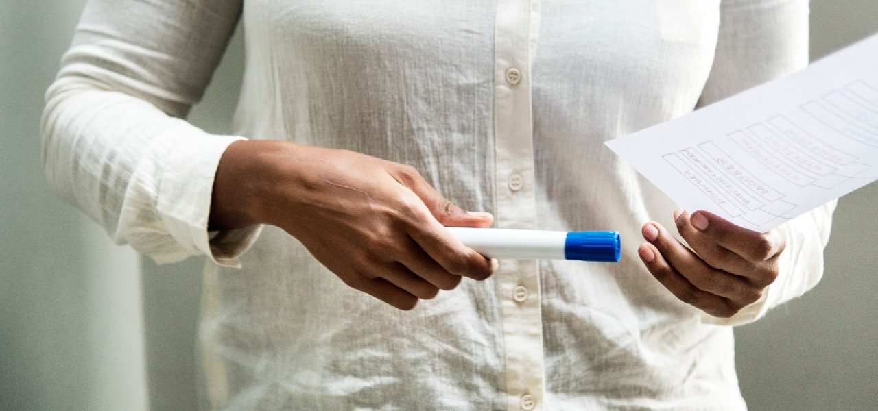 image of woman holding a marker