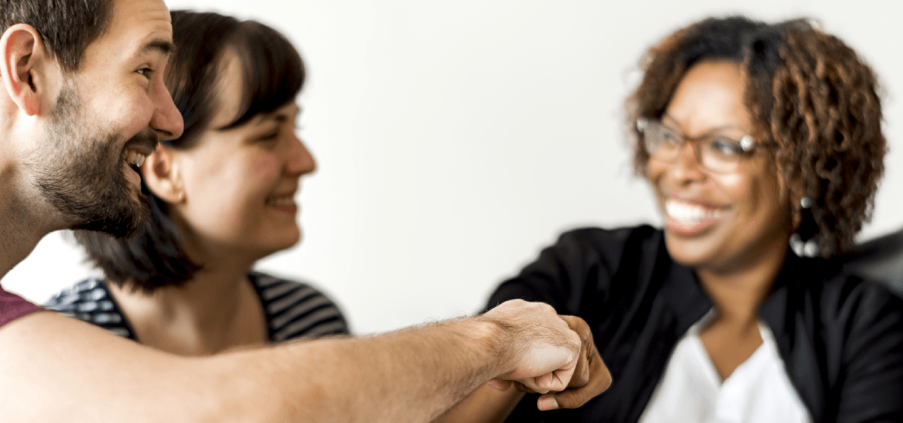 employee giving fist bump